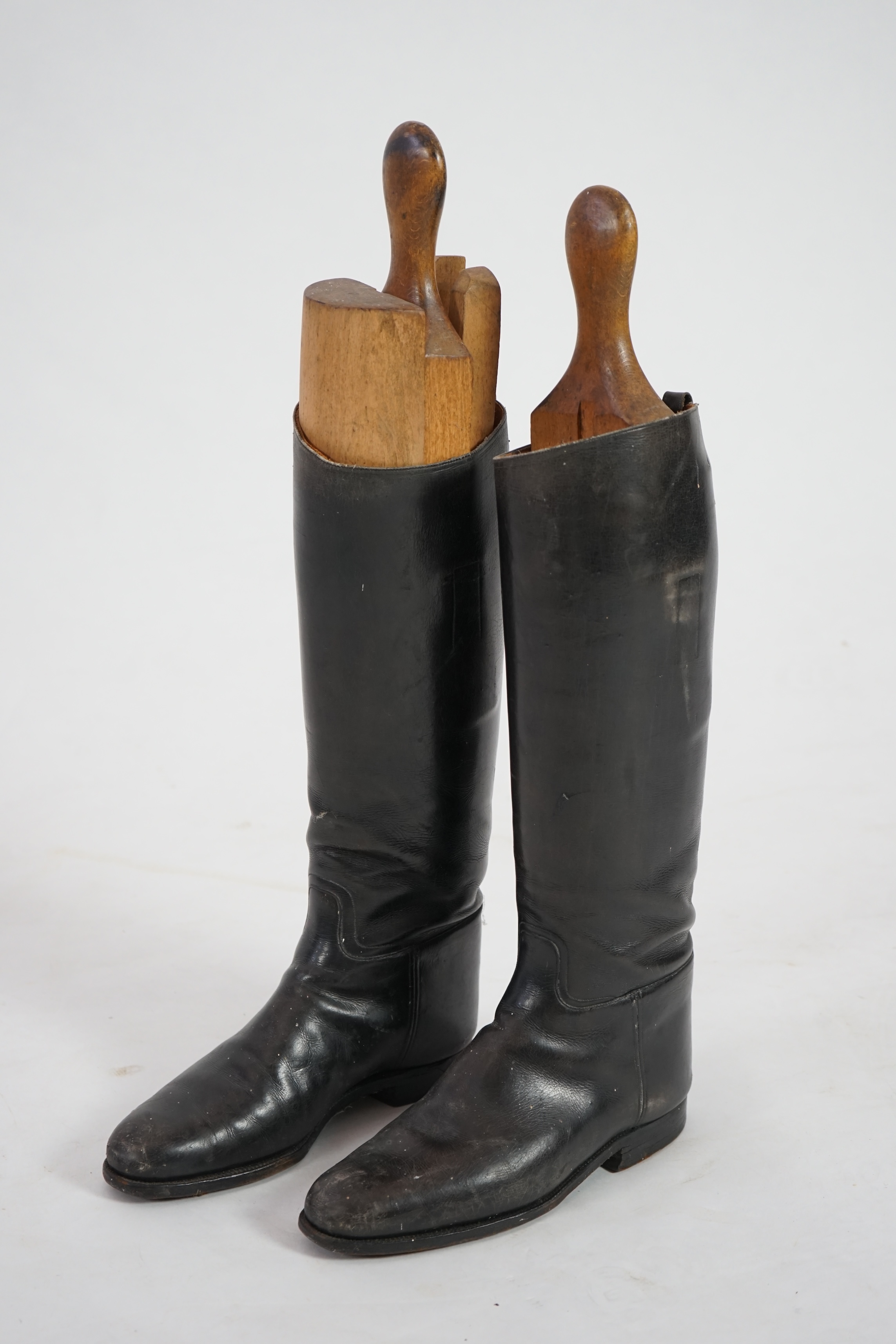 A pair of black leather riding boots